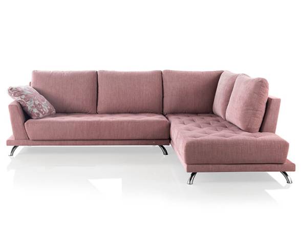 Sofá chaiselongue de color rosa para salón